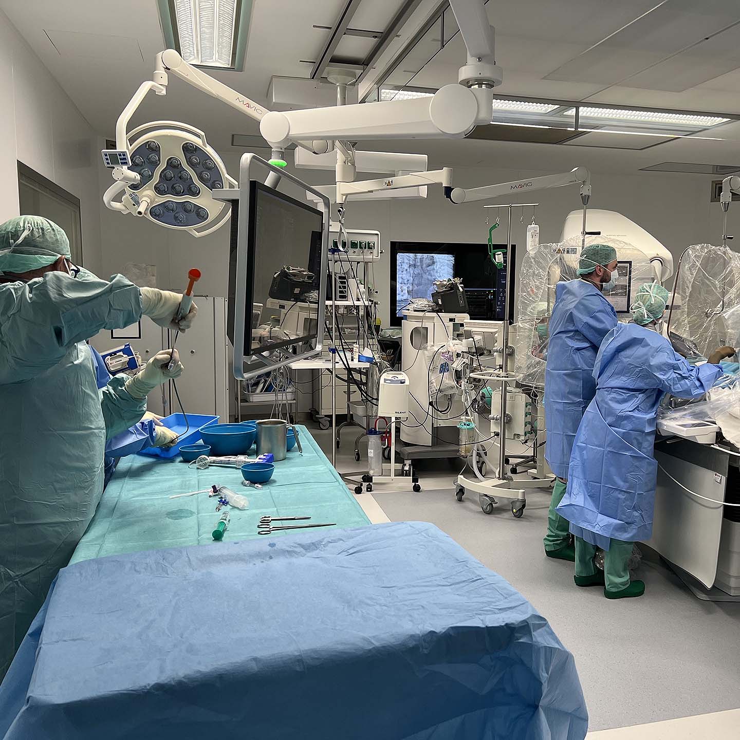 Surgeons preparing for a embolic procedure